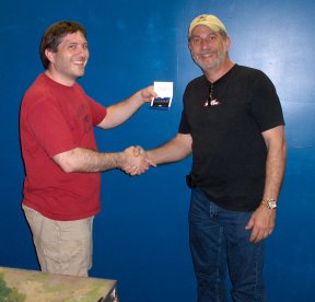Kevin presents Frank with his gift card
